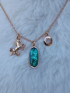 2/$10 December Girl Gold-Tone Necklace with Teal Glitter Pendant and Horse Charm